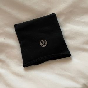 Black Lululemon wrist band with storage for cash, cards and keys!